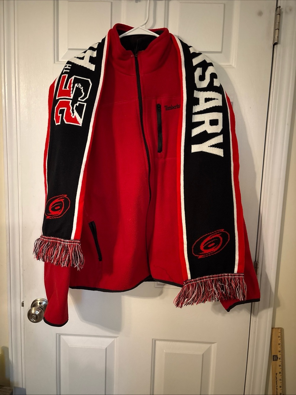 Timberland Red Fleece Jacket with Carolina Hurricanes 25th Anniversary scarf.